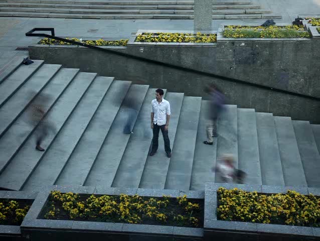 Handsome man standing on the stairs