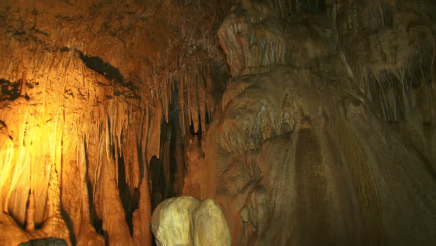 Great ancient caves. Inside, the deep and ancient caves. Moving camera.