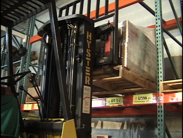 forklift operator placing skid 1