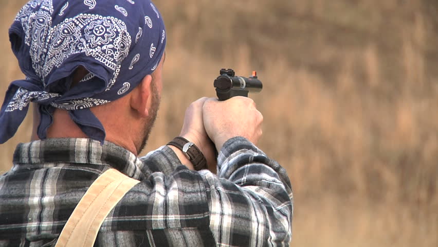 Man shoots automatic handgun
