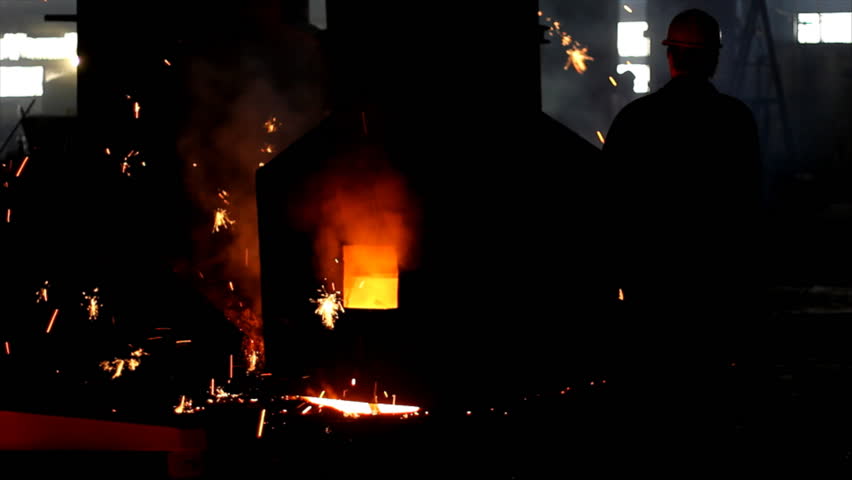 Putting iron in the furnace to melt