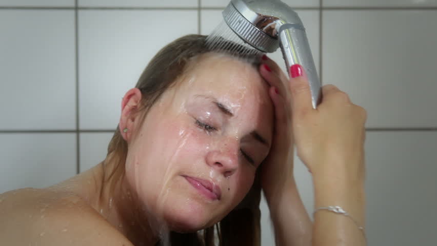 Young woman taking a shower