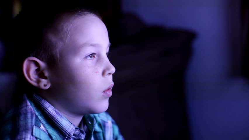 Kid watching TV late at night