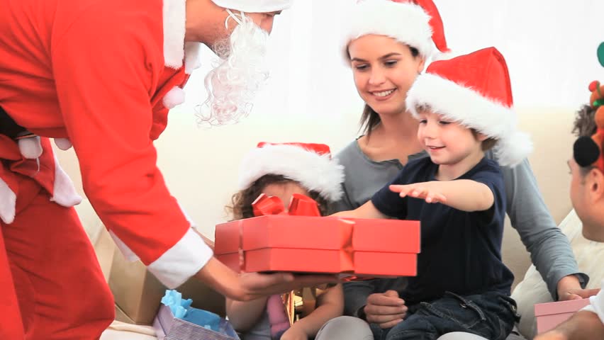 Santa Claus offering a gift to a little boy