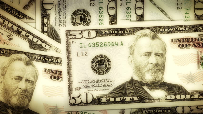 A pile of dollar notes turns into letters that forms the word Wall Street