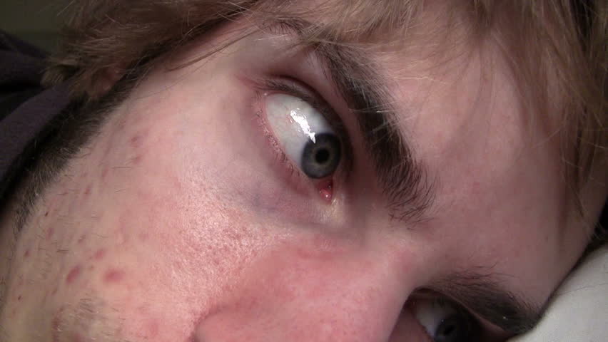 Awake eyes looking around in bed