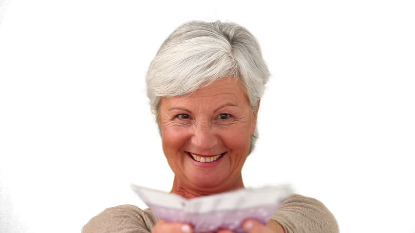 Mature woman proud of what she earned against a white background