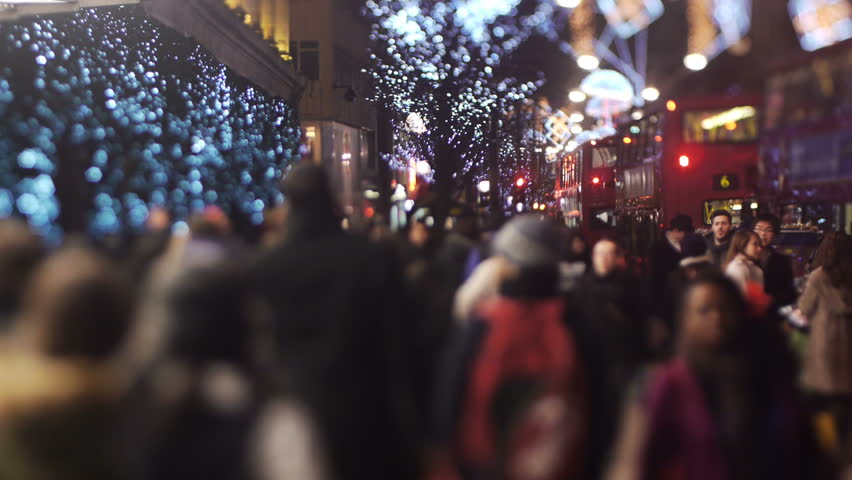 LONDON - DEC 24: Foot traffic on Oxford Street, Dec 24 2010, London, England.  Oxford Street is a major thoroughfare in the City of Westminster in the West End of London, England. There are 548 shops in Oxford Street and it is Europe's busiest shopping st