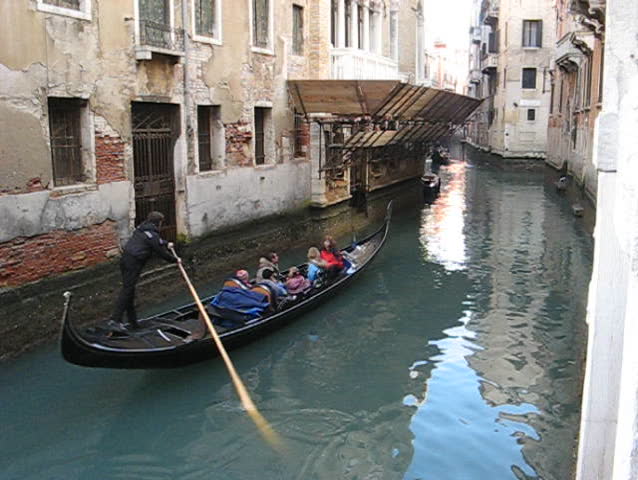 Venice: Gondola passage along an unknown canal
