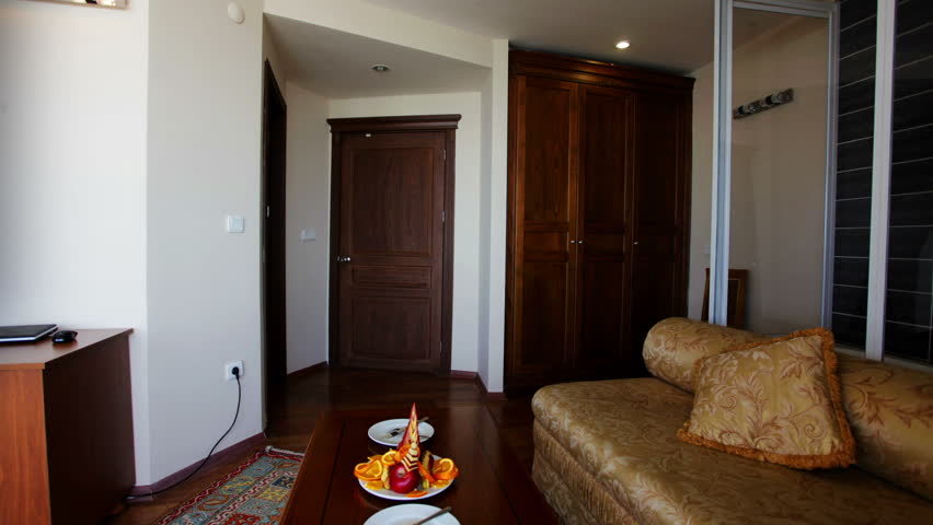 a shot in a nice hotel room, with terrace overlooking the sea -Left Pan shot