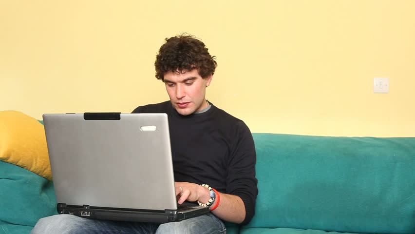 Man Annoying His Friend While Working at Computer