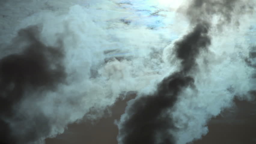 Heavy pollution, environment issues. Smoke stakes against cloudy sky.
