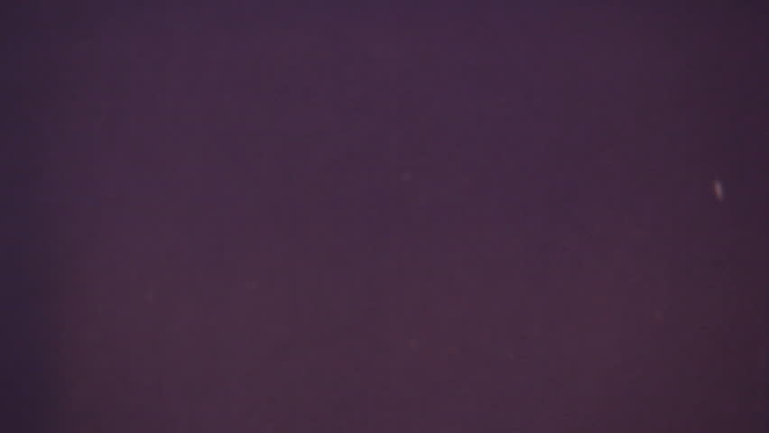 Close-up macro shot of actual 8mm film projector gate.