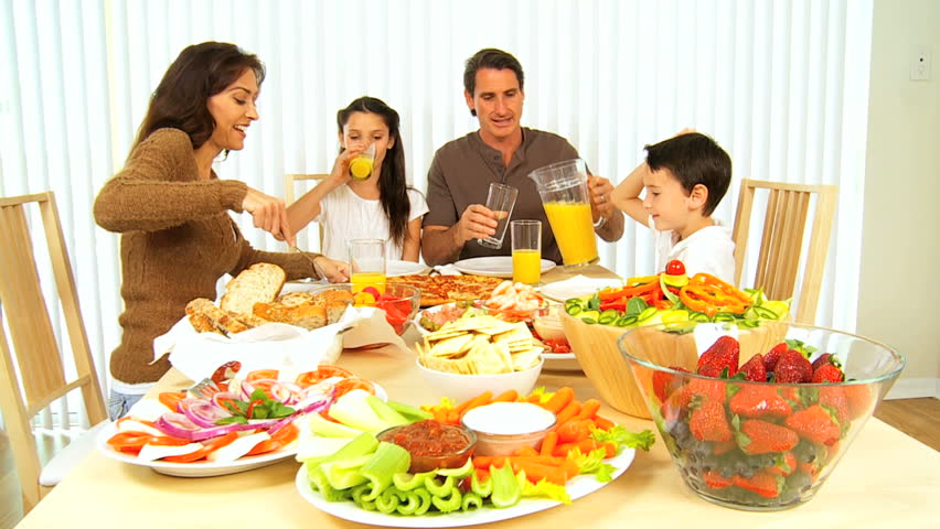 Healthy young family sharing a nutritious meal together