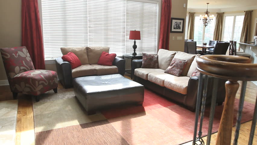 Montage of different rooms in a beautiful luxury home, shot on a moving dolly. Features a family room, kitchen, dining room, bathroom, bedroom, and dining room.