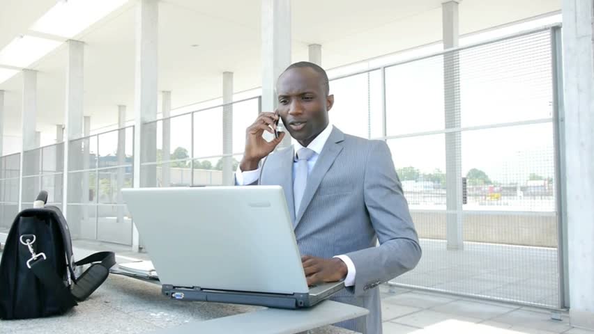 Businessman working with laptop computer outside the office