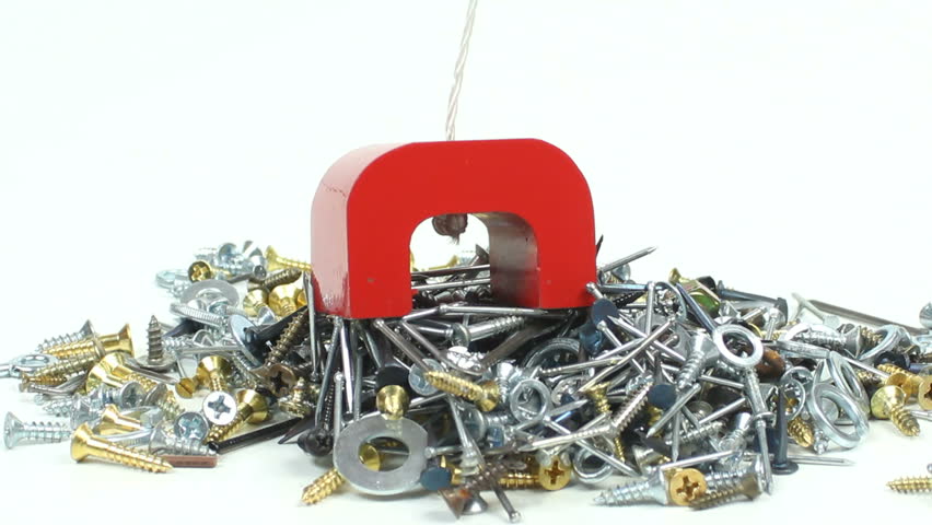 Red horseshoe magnet lifts large clump of nails, screws and washers. 1080p