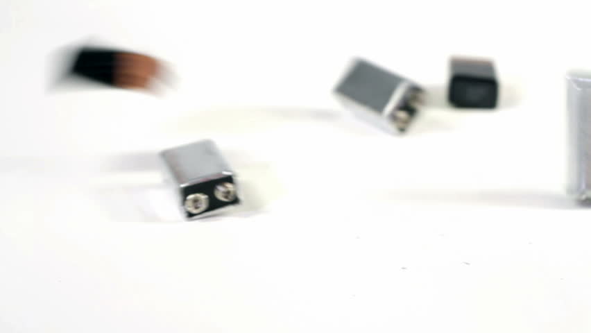 9-volt batteries falling onto white background