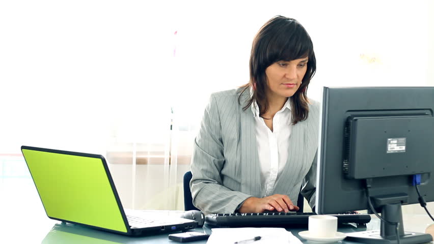 Busy multitasking attractive businesswoman in the office timelapse