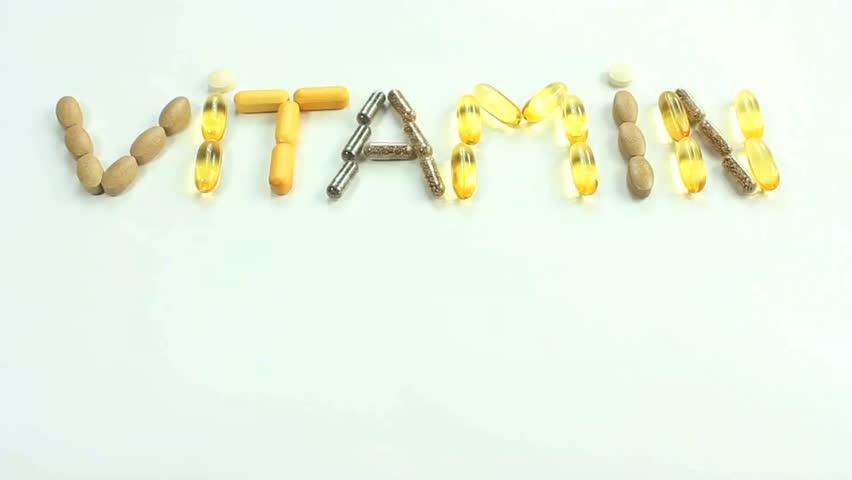 Colorful letters ABCDE appear, one at a time, below the word VITAMIN spelled out with vitamin pills. 1080p