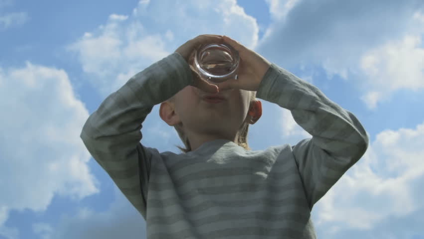 Boy drinking water.