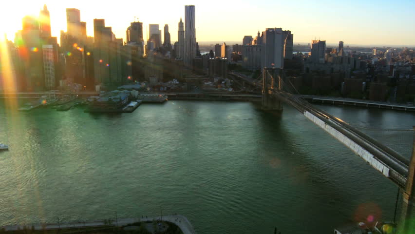 Aerial view of the Setting Sun over Manhattan and the Brooklyn Bridge, New York, North America, USA