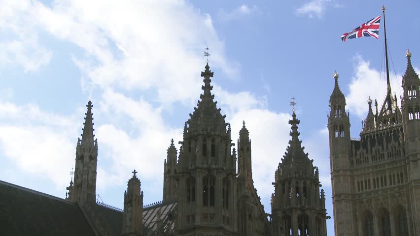 Pan over House of Parliament with Union Jack