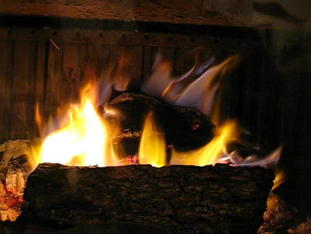 Hot fireplace full of fire wood and fire
