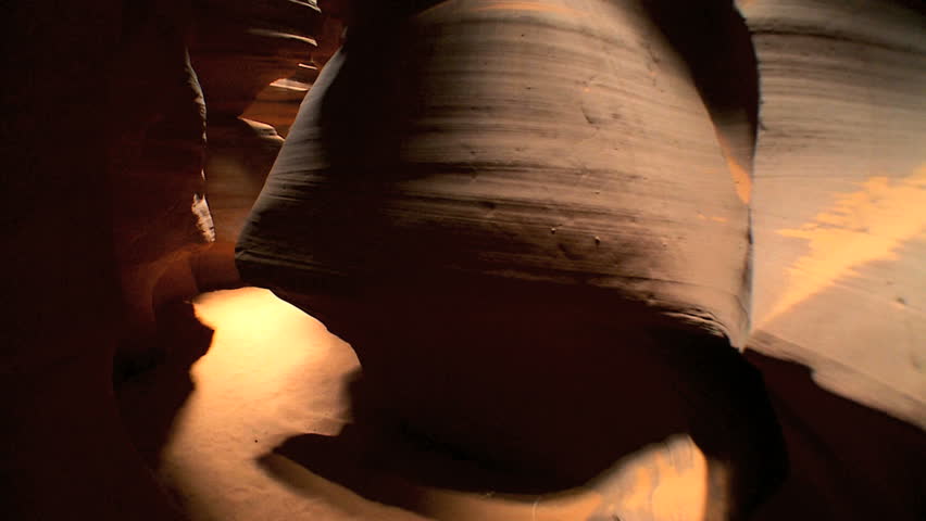 Tracking shot moving through environmental rock formations created by climatic weather conditions over periods of time