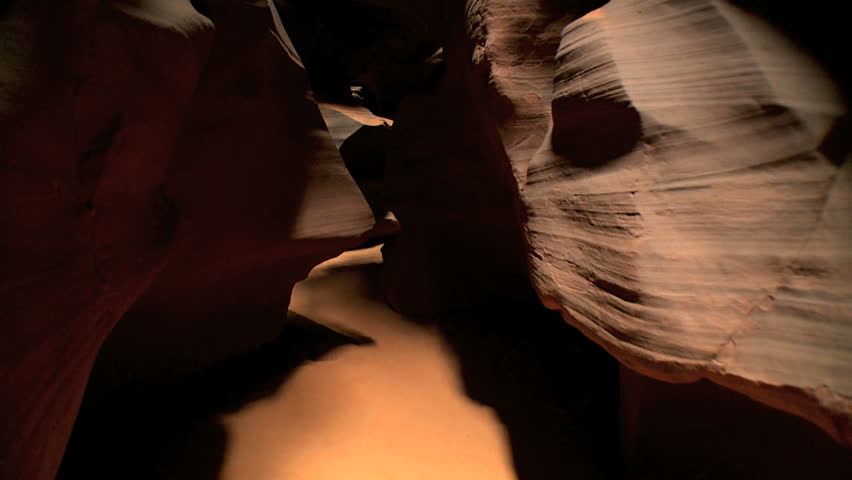 Tracking shot moving through environmental rock formations (created by climatic weather conditions over periods of time)