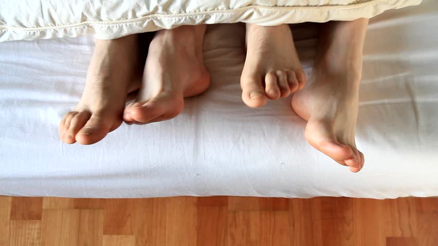 feet into the bed