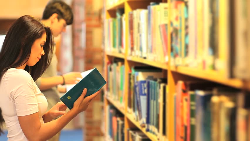 College students reading in a library