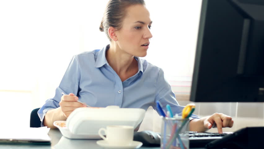 Busy multitasking attractive businesswoman in the office, timelapse