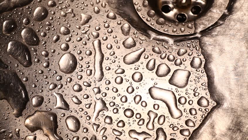 Close-up of kitchen sink with water drops