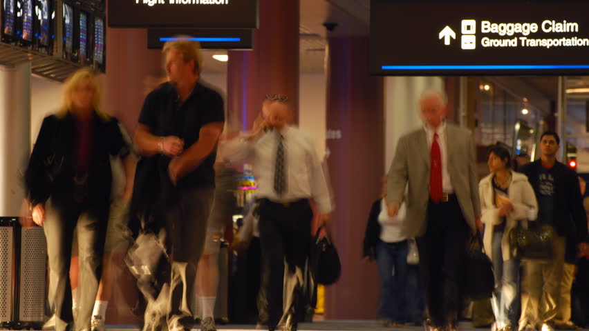 Timelapse of travelers in an airport