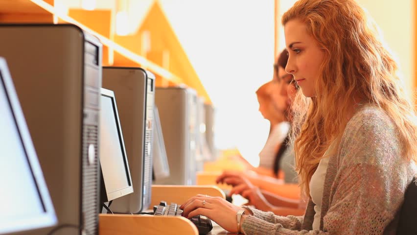 Student using a computer in a library
