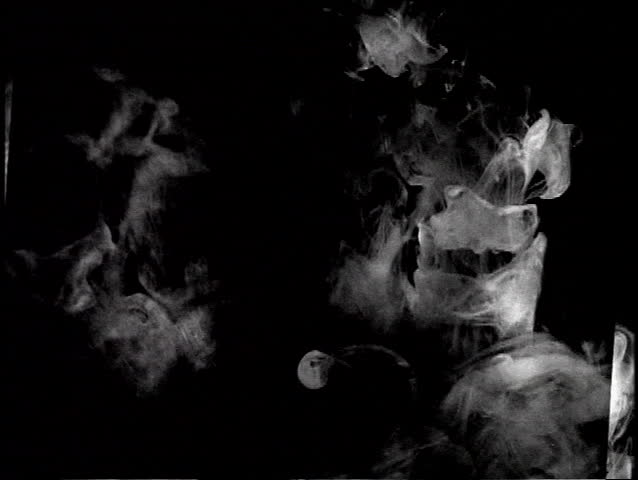 White ink pouring into black liquid