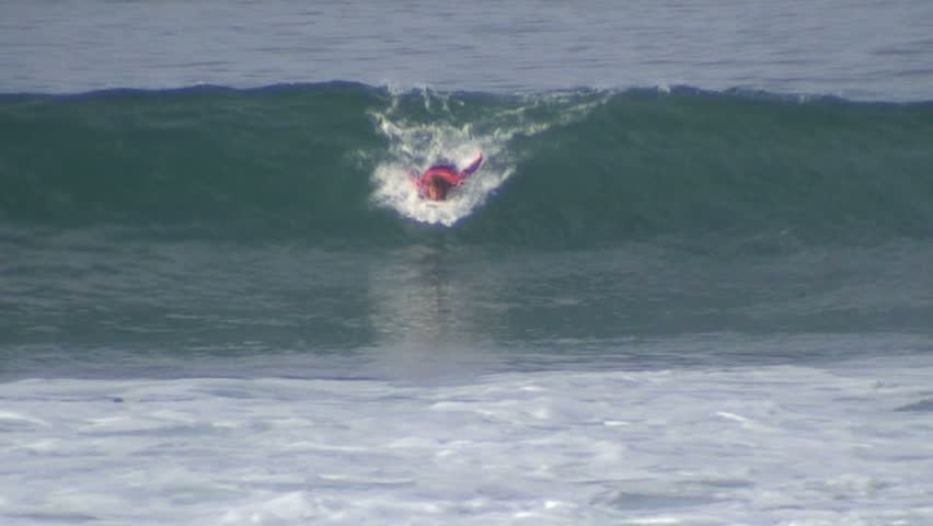 Surfer rides wave all the way to end