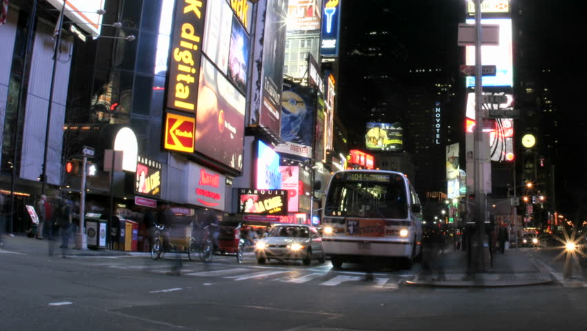 NEW YORK, NY - CIRCA 2005: (Timelapse View) Slow pans right in an accelerated shot of traffic and pedestrians in Times Square circa 2005 in New York, NY.