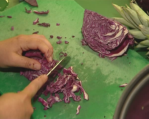 Red cabbage cut with knife. Healthy ecological environment-friendly food. 