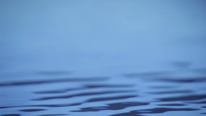 Water background. Small blue water waves with copy space.  Footage.