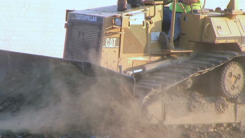 Dozer Clears Edge of Road 