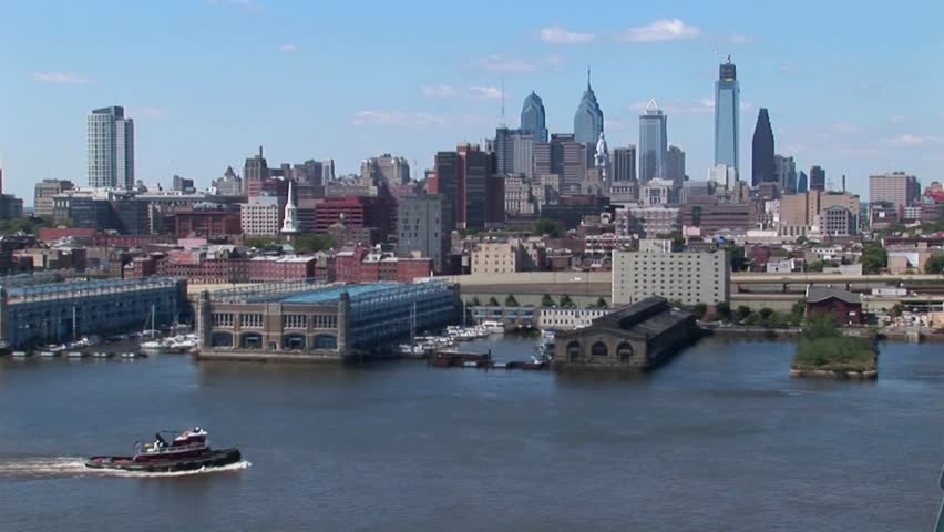 A boat passes by the Ben Franklin Bridge that leads to Philadelphia, Pennsylvania. 