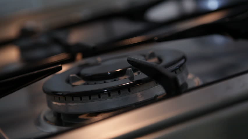 Burning gas stove. Close up, soft focus.