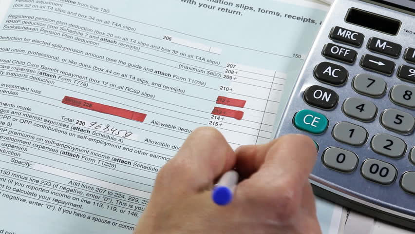 Accounting. Business woman working with a calculator and documents. 
