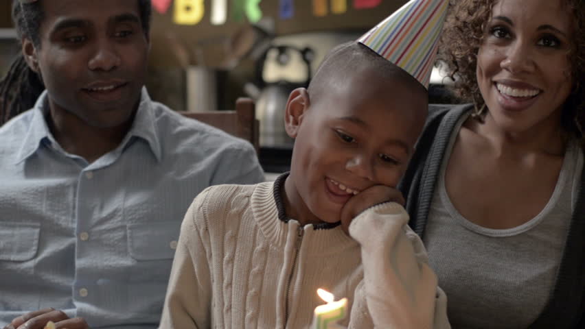 A Modern African American Family completes tasks around the house from paying bills, cleaning, to celebrating with each other.