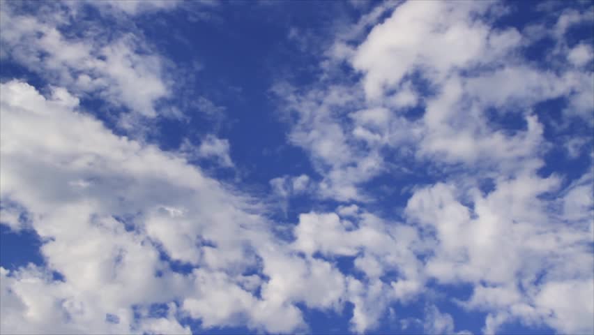 Time-lapse wispy clouds drift across a deep blue sky loop. Loops with fade transition at the end. HD widescreen.
