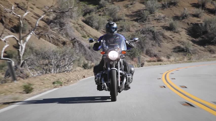  A man rides a motorcycle down a mountain road circa 2009 in Ojai.