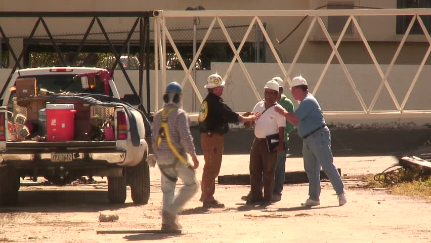 WEST PALM BEACH,  FL - FEB 13:  Workers begin clean up  at the Flagler condo site after the implosion February 13,  2010 In West Palm Beach, Florida. 