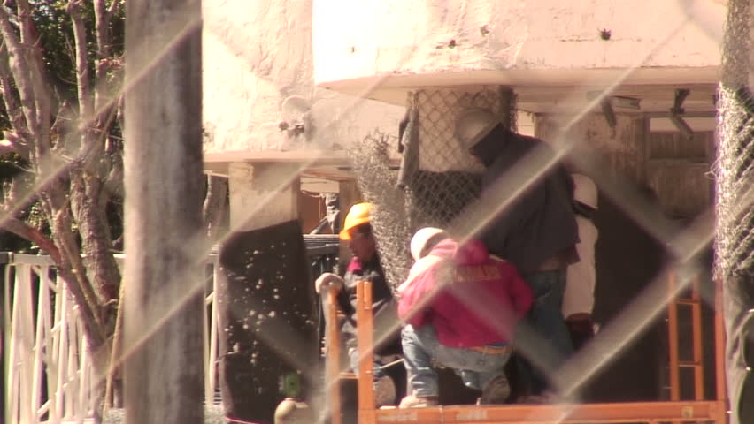 WEST PALM BEACH,  FL - FEB 13:  Workers begin clean up  at the Flagler condo site after the implosion February 13, 2010 In West Palm Beach, Florida.